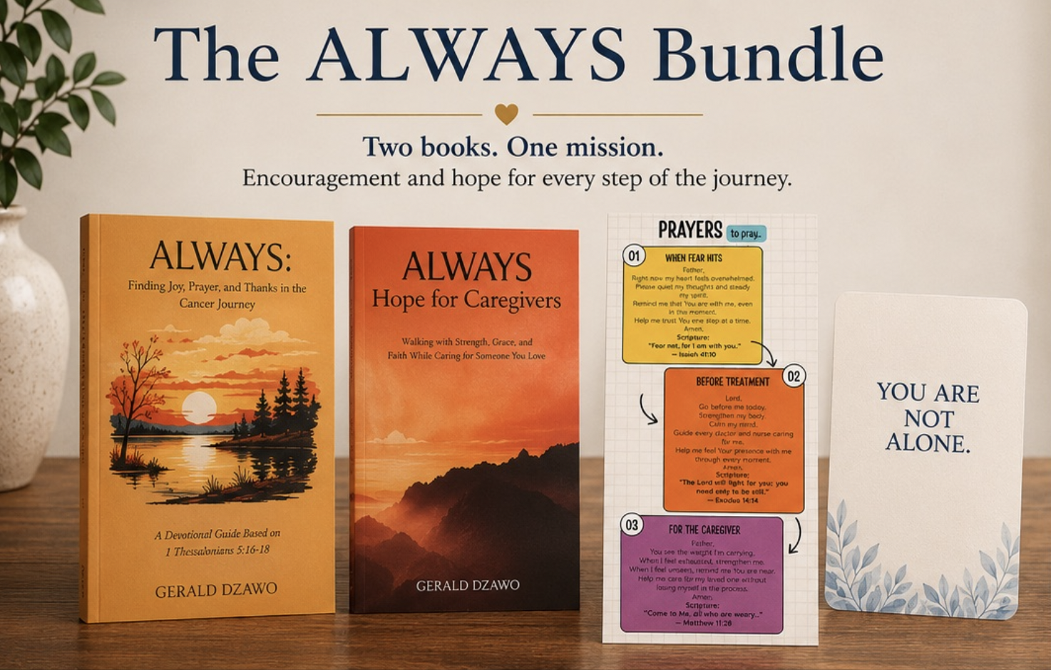 Display of two books, titled 'ALWAYS: Finding Joy, Prayer, and Thanks in the Cancer Journey' and 'ALWAYS Hope for Caregivers,' alongside prayer cards and a white card with blue text 'YOU ARE NOT ALONE,' on a wooden surface.