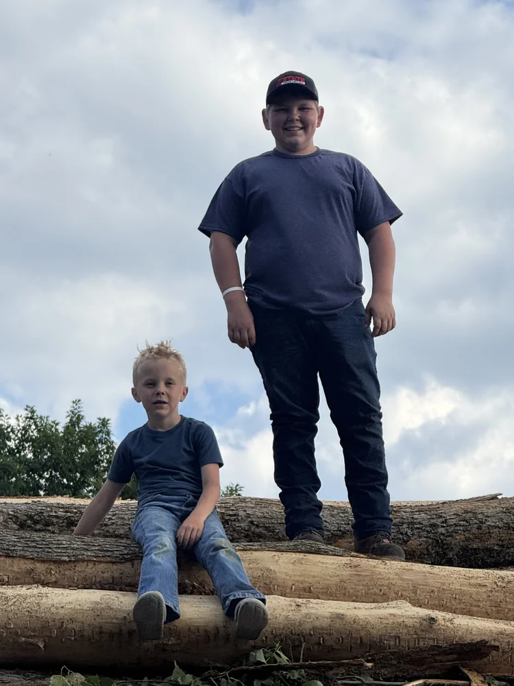 The next generation of the Foster family learning in the woods