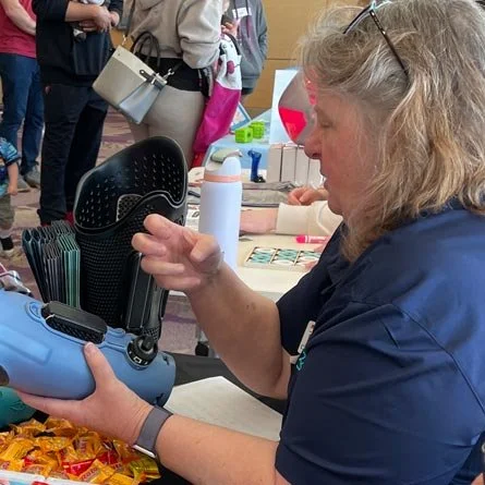 Valerie demonstrates how the Quatro Socket works at the Limb Difference Fair.