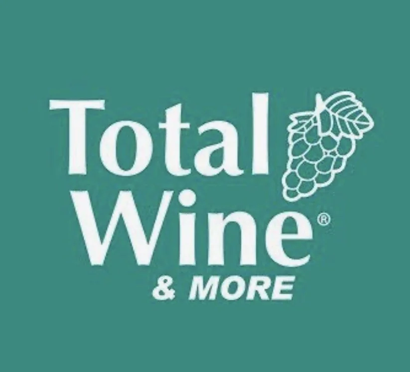 Logo for Total Wine & More featuring the brand name and a bunch of grapes illustration.