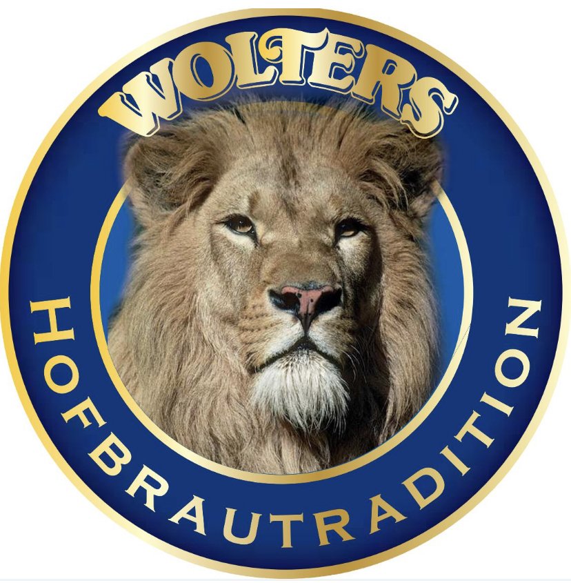 A logo with a regal lion's face in the center, surrounded by a blue and gold circular border. The text on the border reads 'WOLTERS' at the top and 'HOE BRAUTRADIEN' at the bottom.