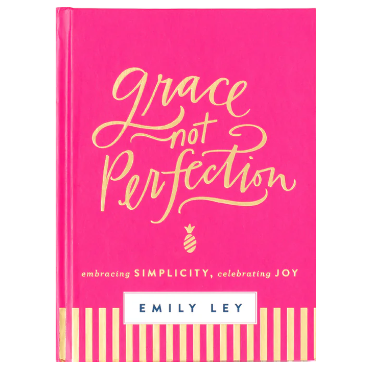 Book cover titled 'Grace not Perfection' by Emily Ley, featuring pink and gold design with striped bottom border and a small pineapple icon.
