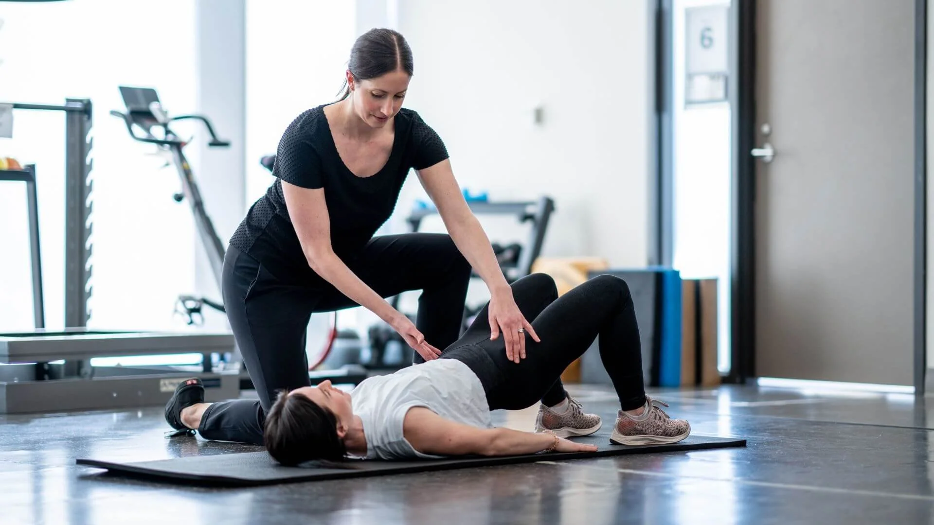 personal trainer working with a client