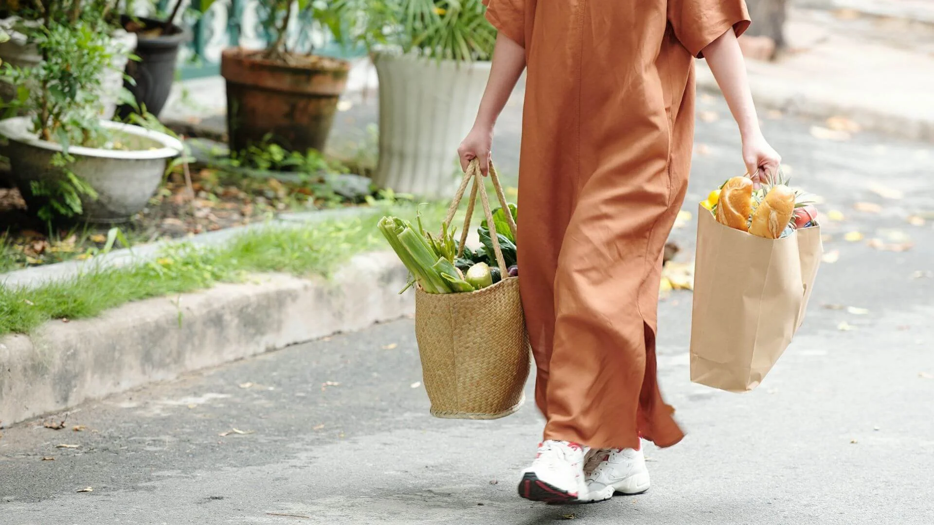 a person carrying heavy groceries