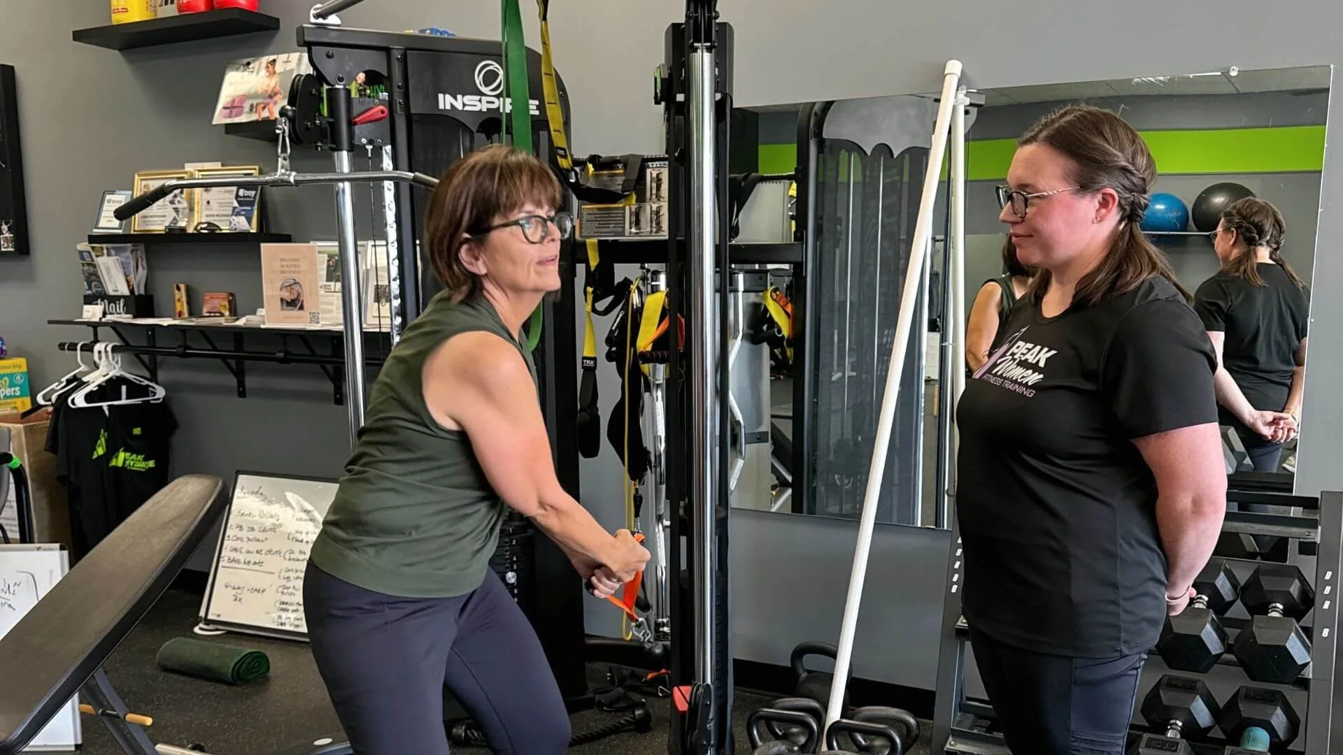 personal trainer helping a client exercise at our personal training studio in troy michigan