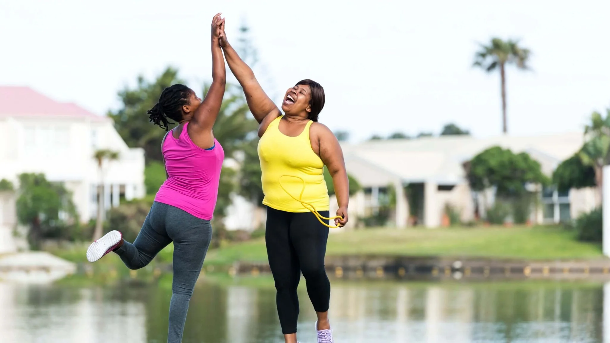 two women exercising and happy