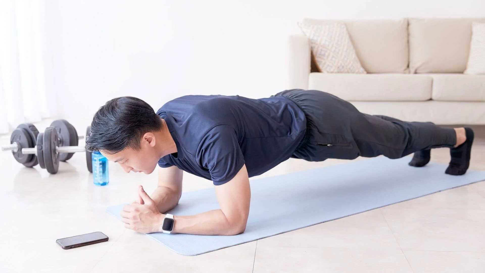 man doing a plank to strengthen his lower back