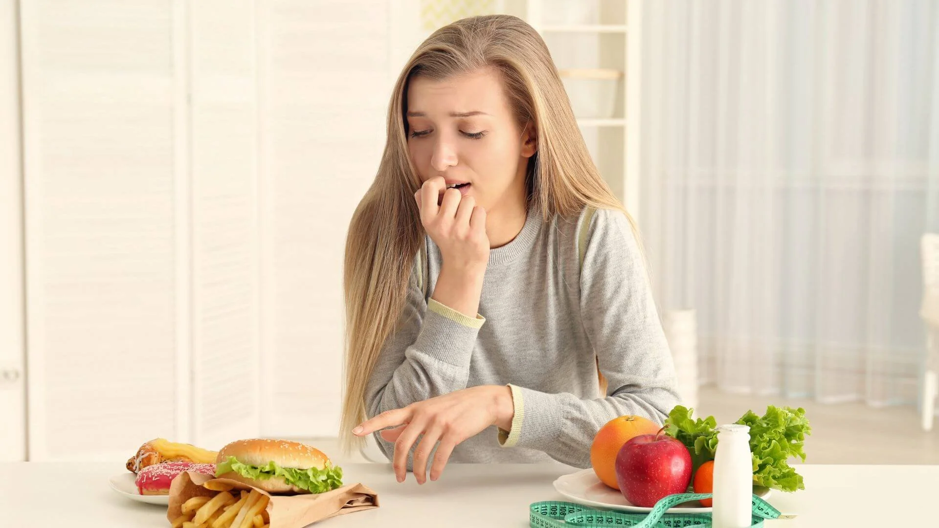 woman looking conflicted about what to eat