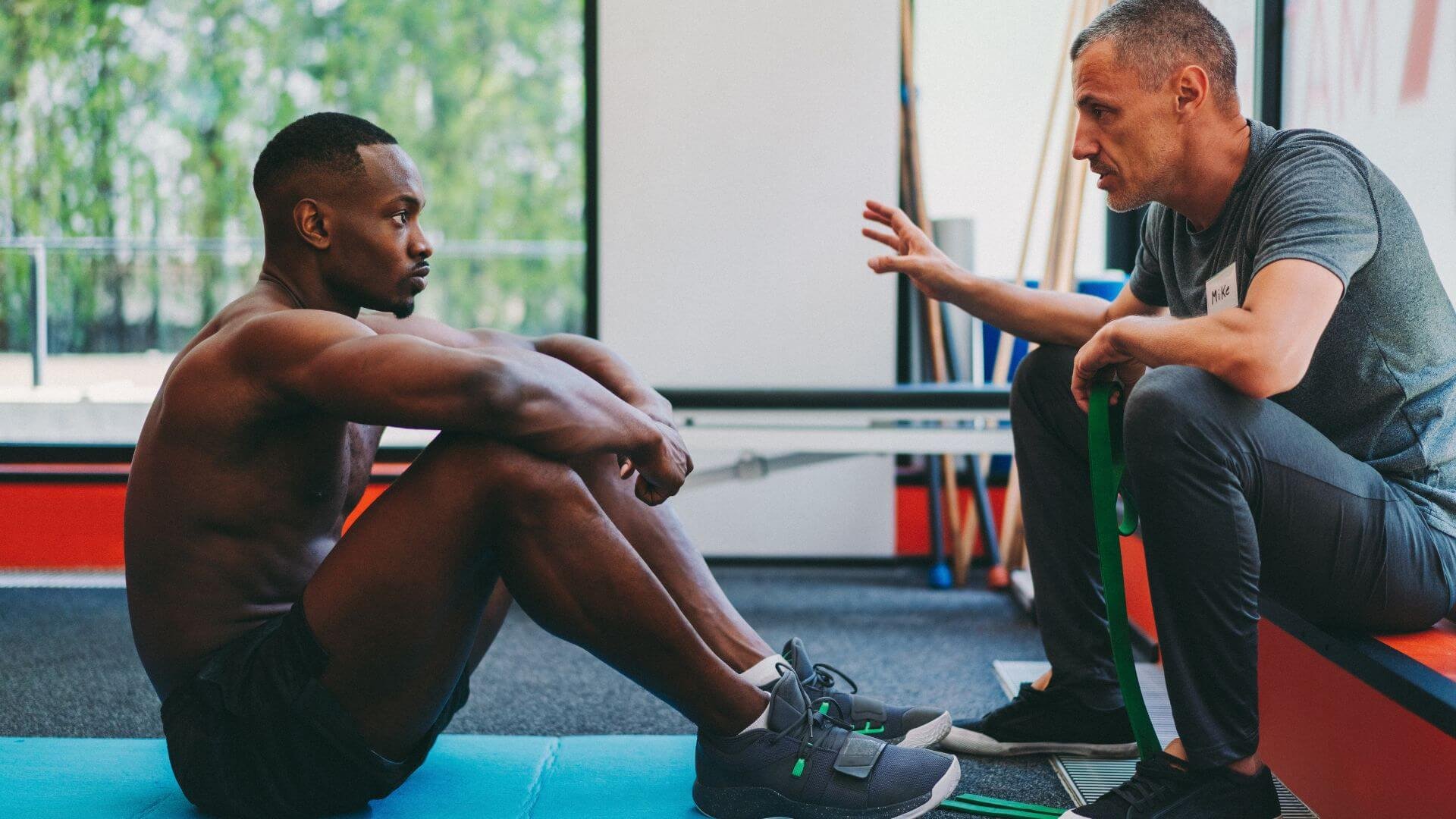 personal trainer talking to a client