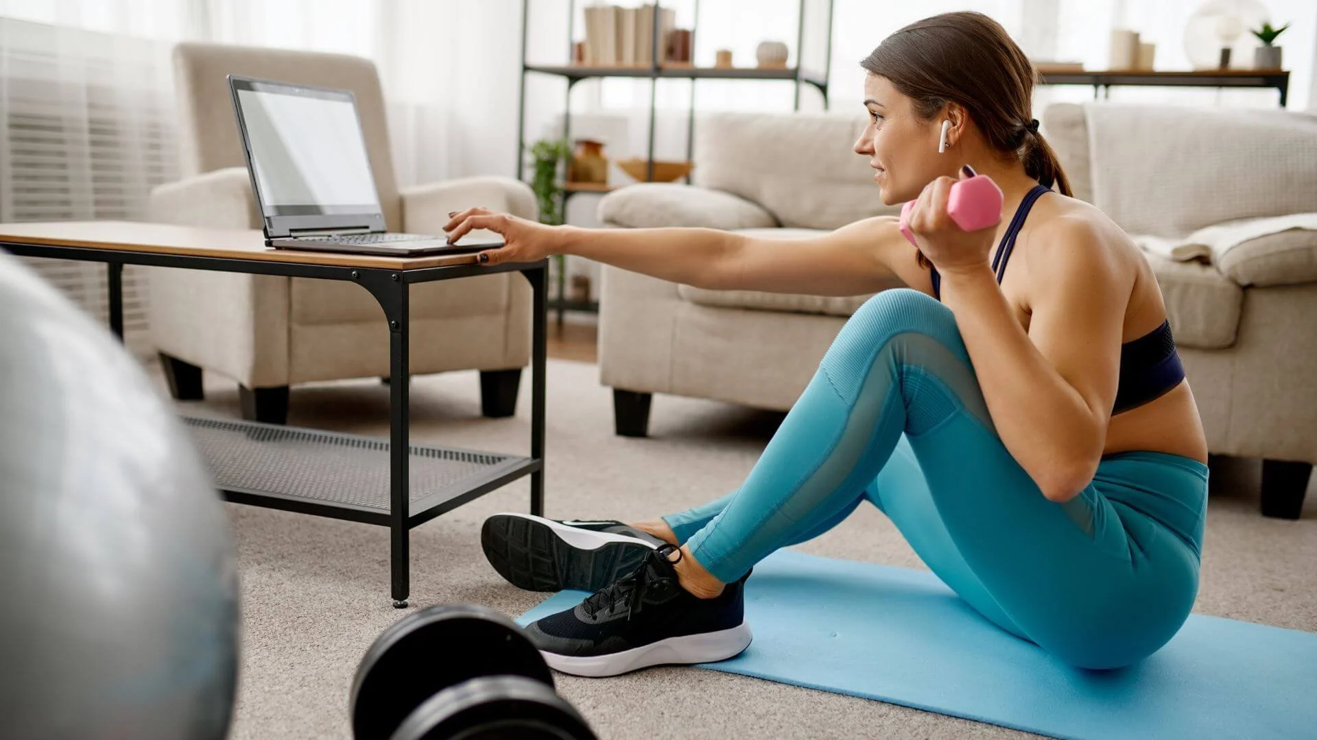 woman getting ready to start her online personal training session
