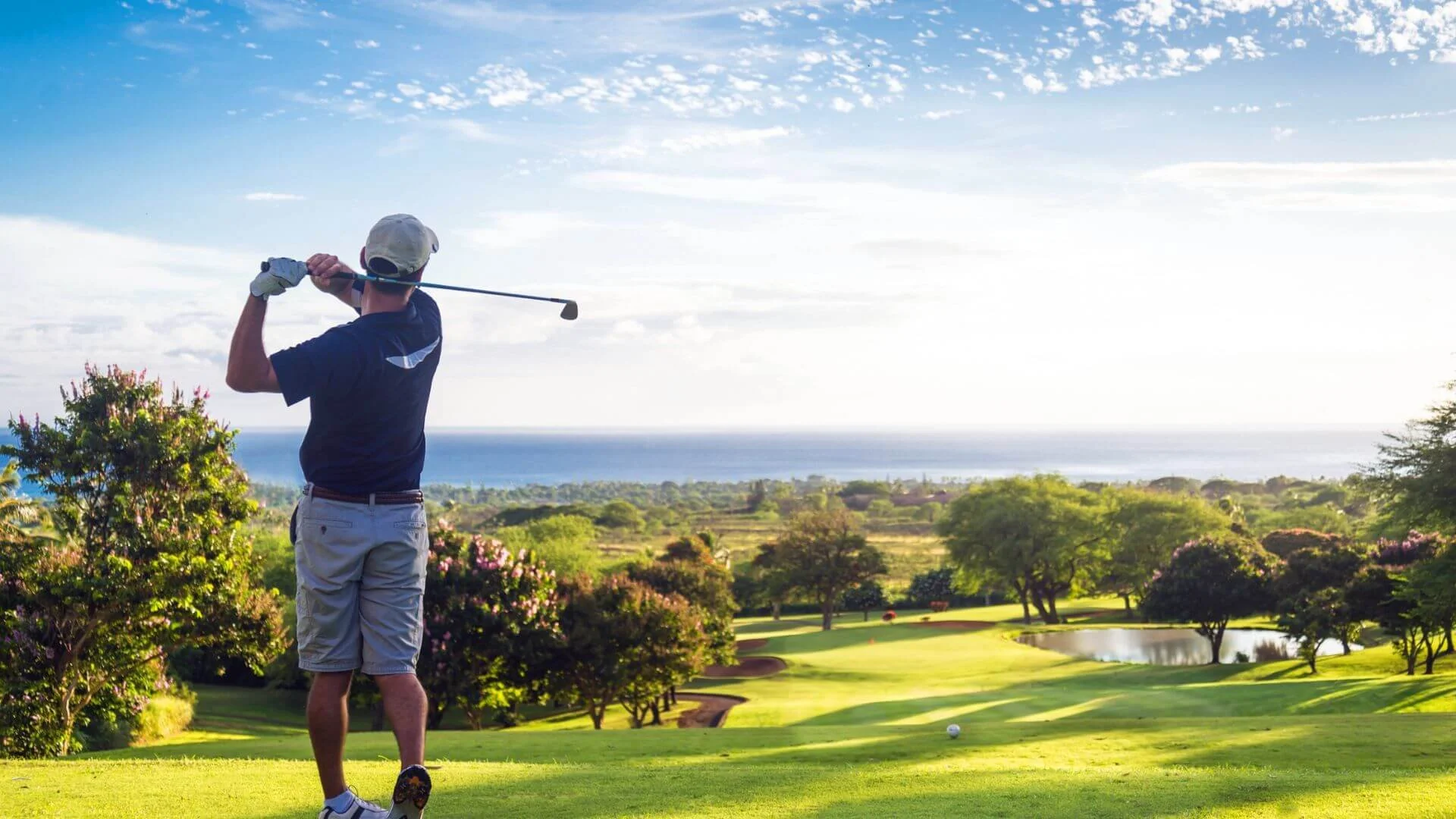 man golfing on a beautiful day