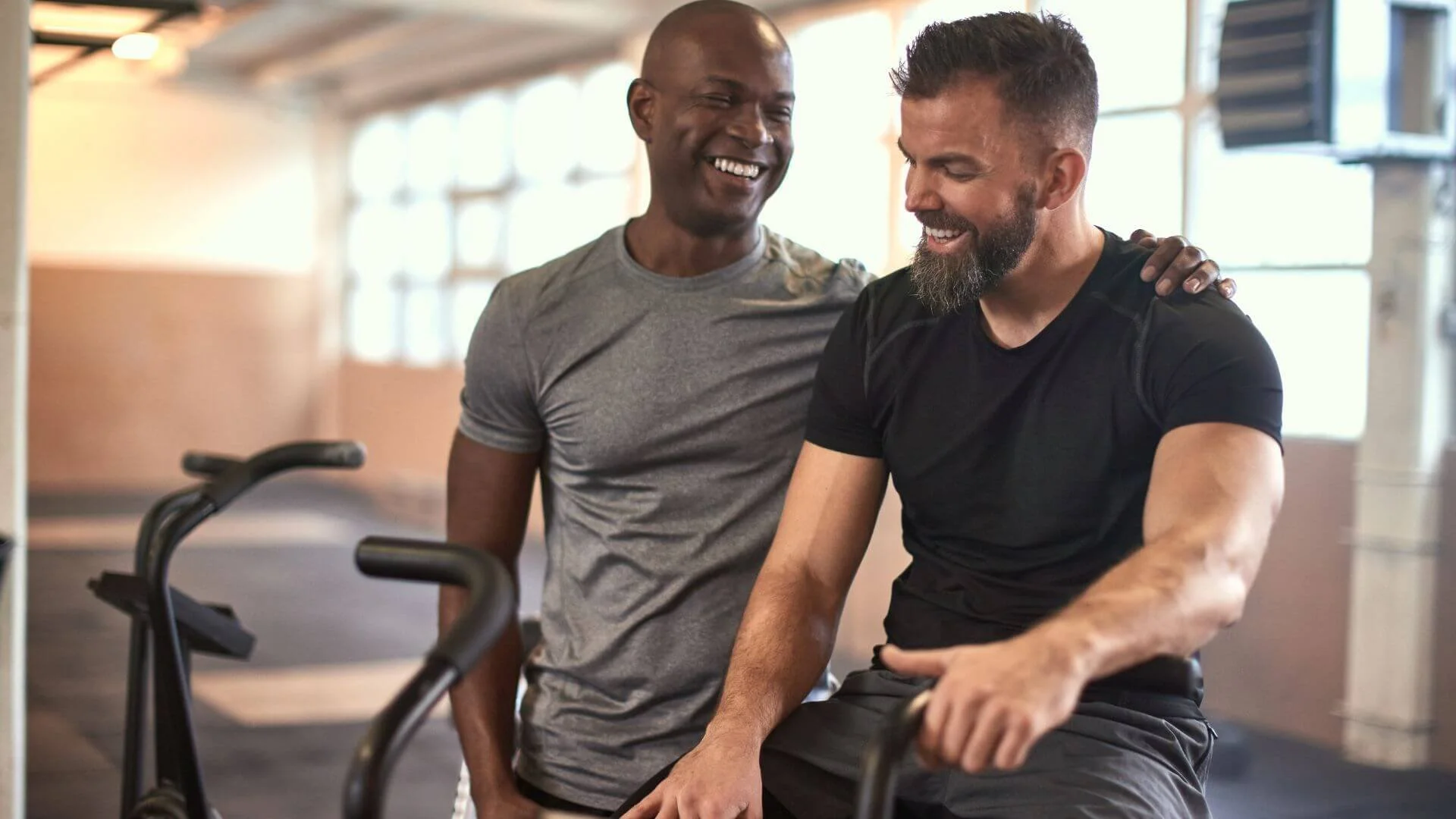personal trainer laughing with a client