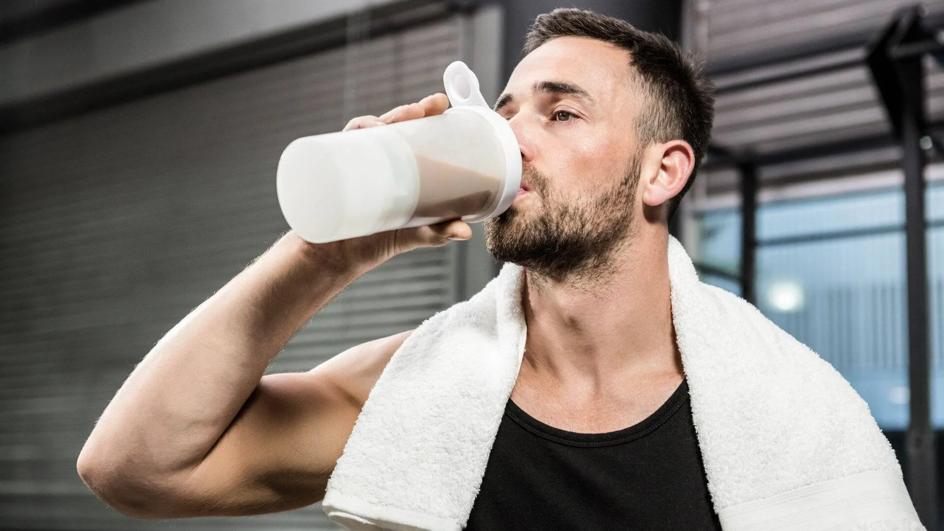 man drinking a preworkout