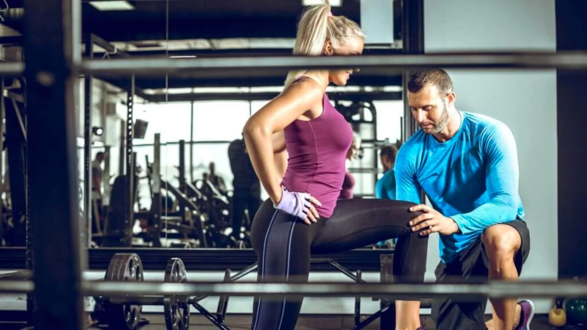 woman exercising with her workout trainer