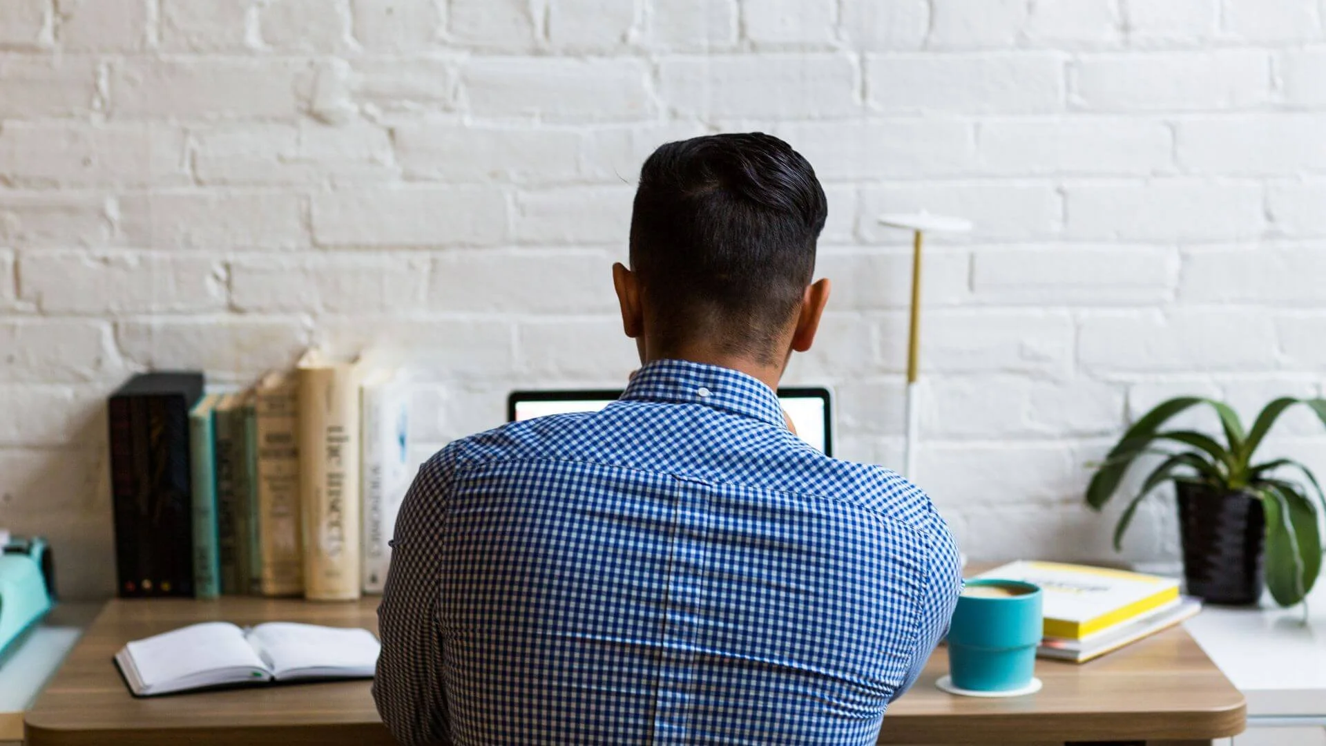 man sitting at a desk