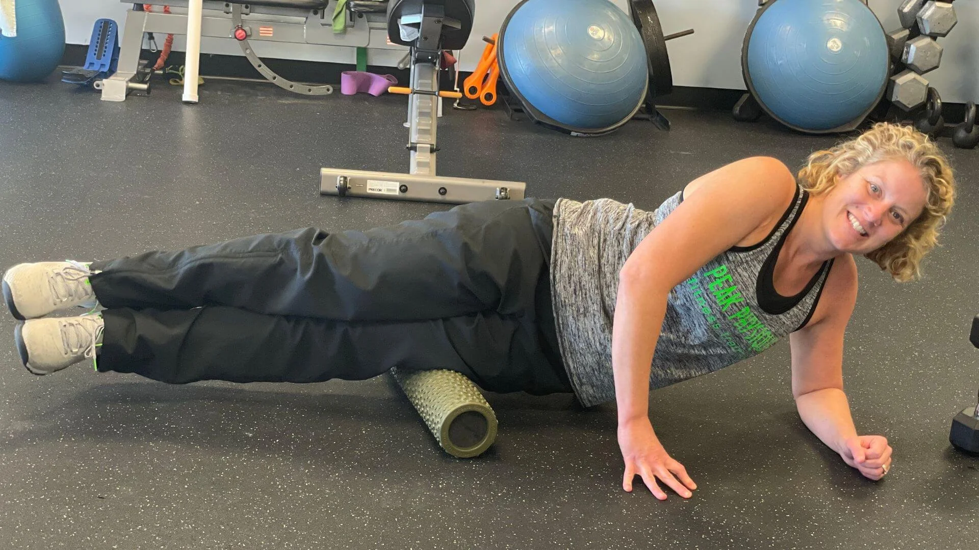 lissa, personal trainer, foam rolling her knee