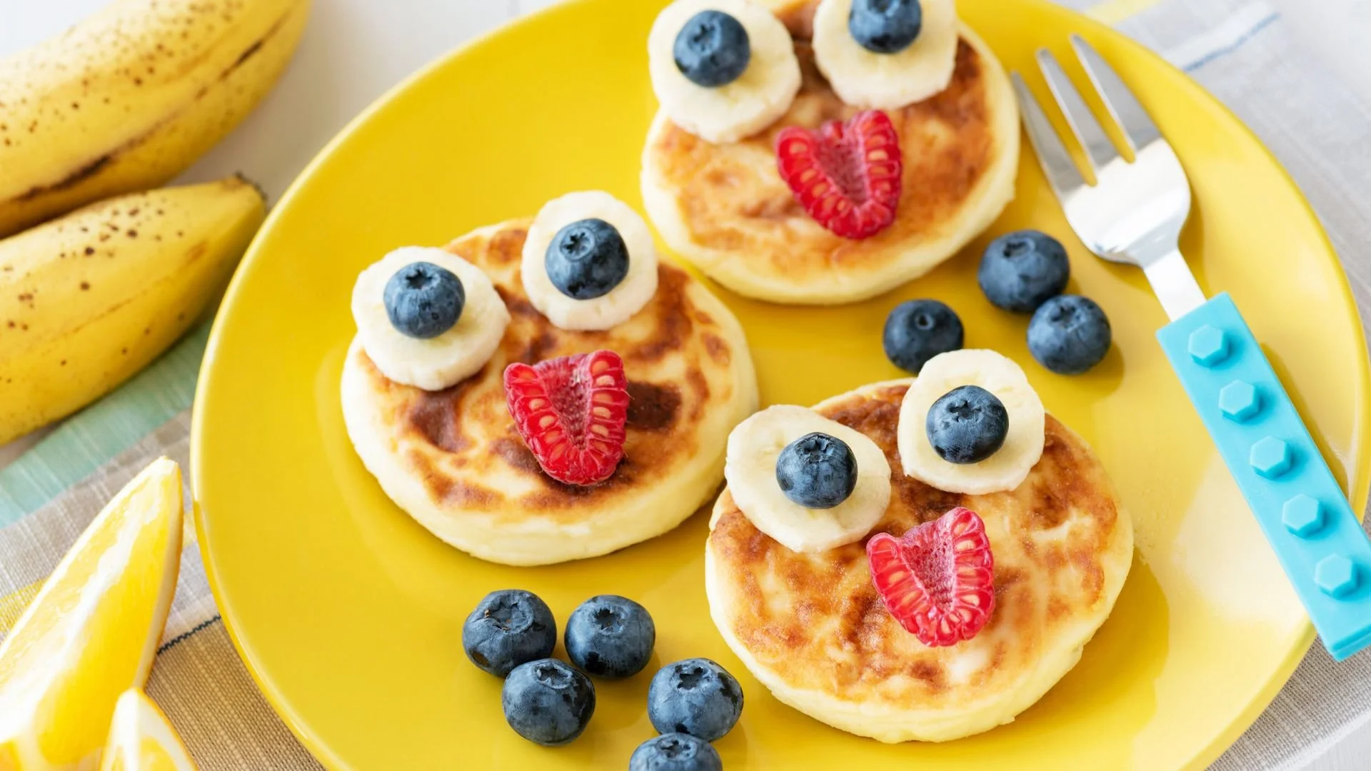 pancakes with fruit making smiling faces