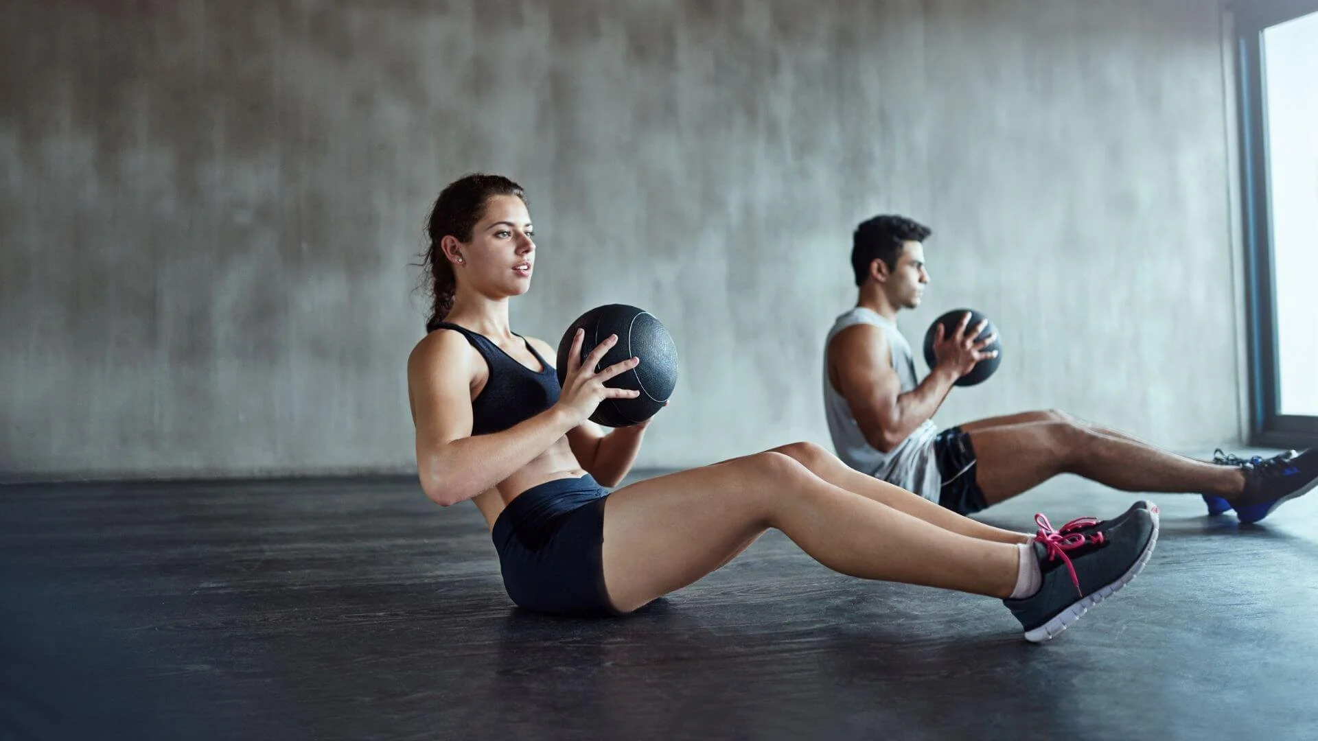 two people exercising their core to burn stomach fat