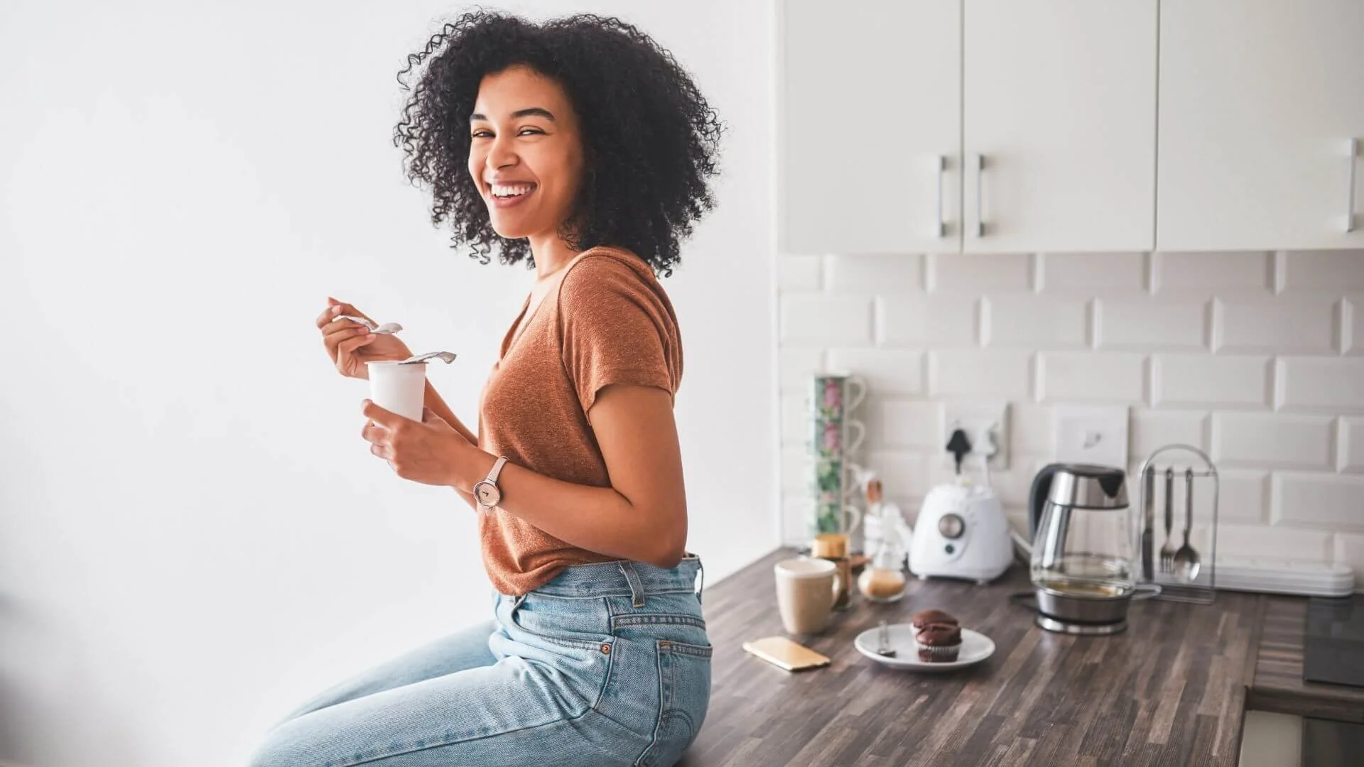 woman happily eating a tasty low calorie snack