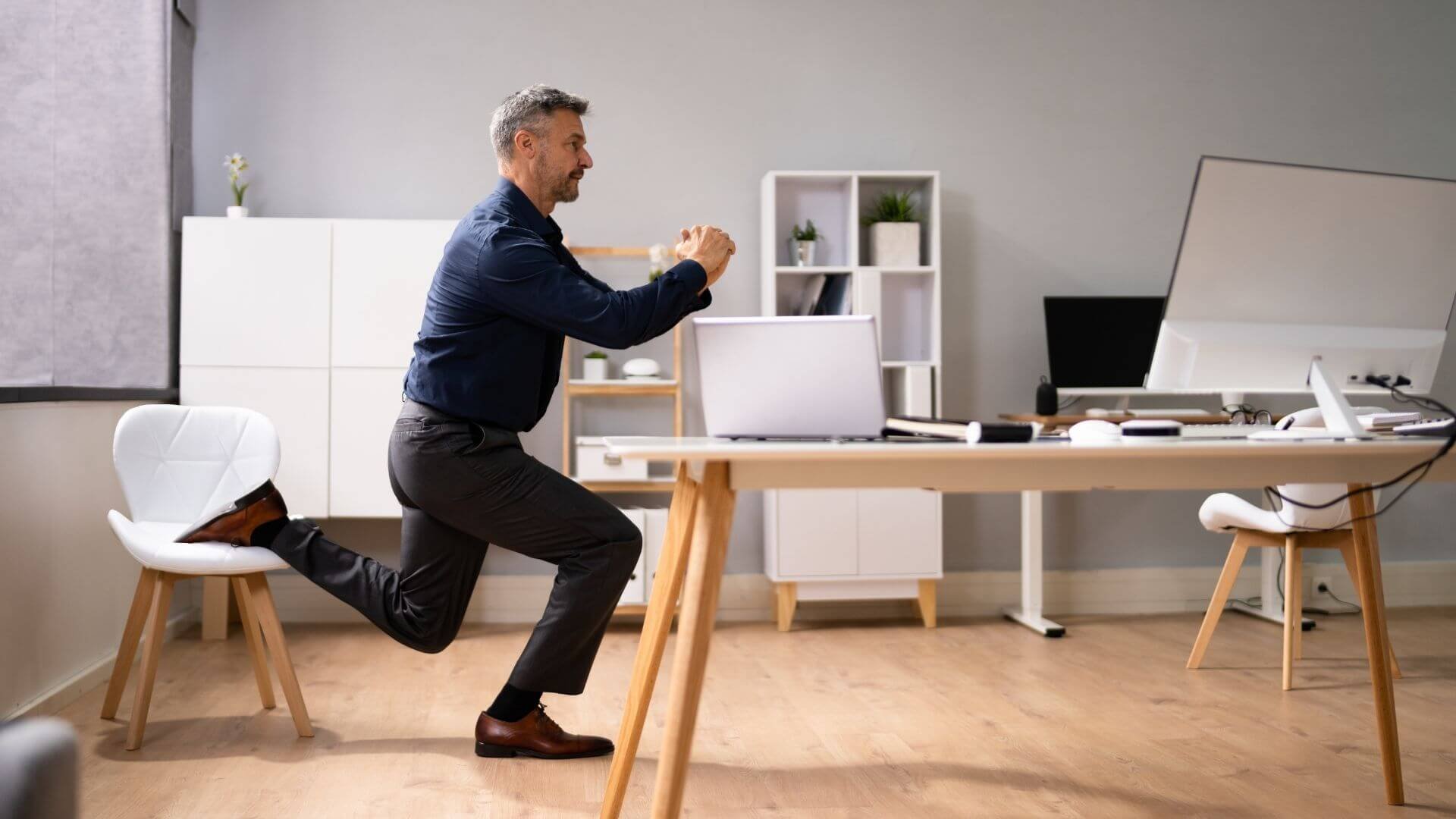 man doing exercises in his office
