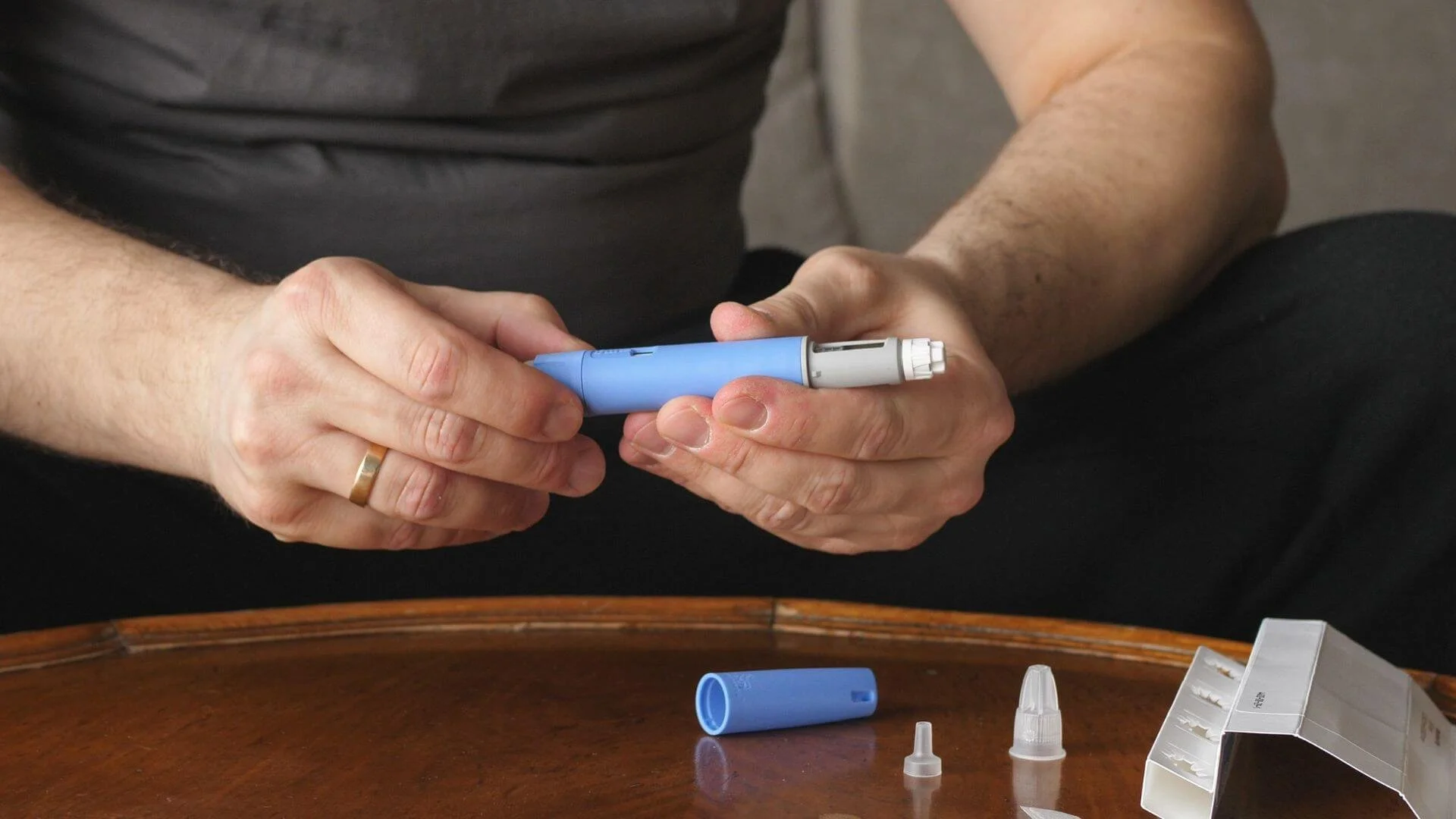 person opening up to use a weight loss shot