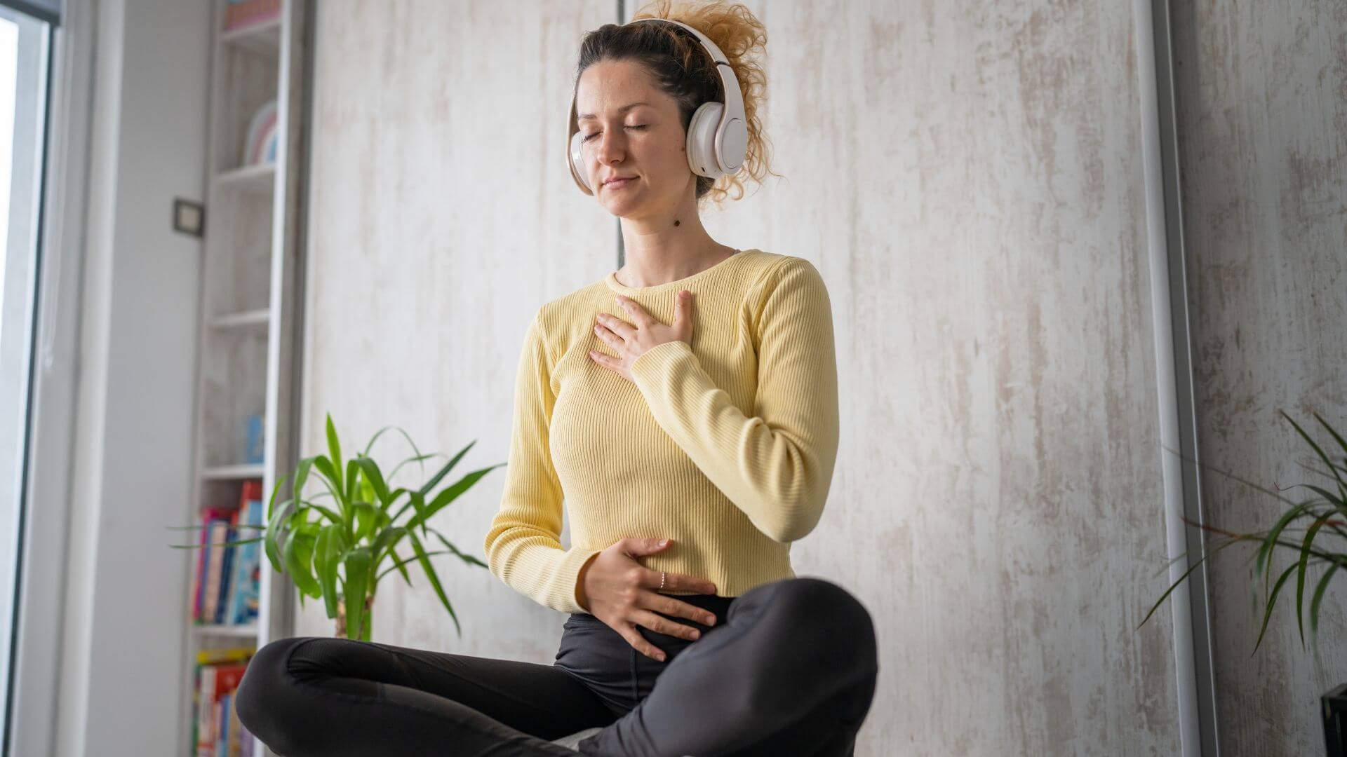 woman deep breathing to help calm her nerves