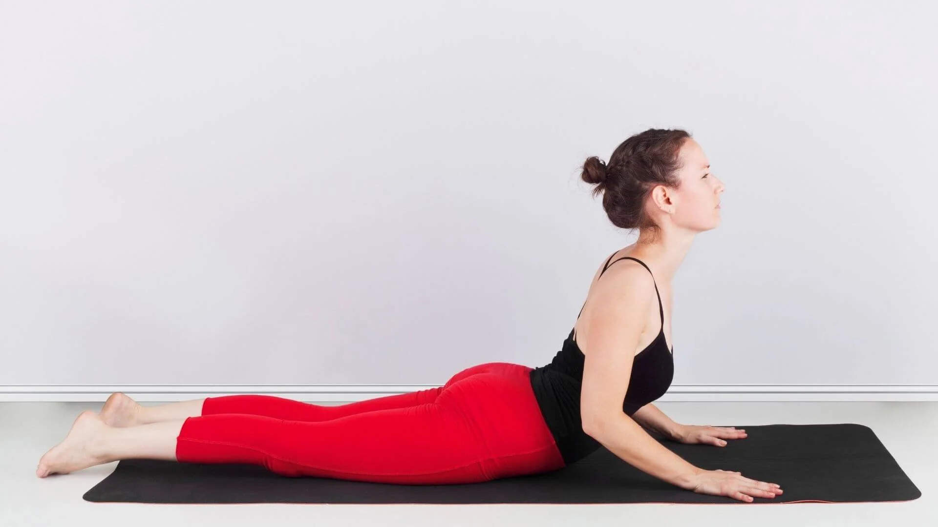woman doing a Half Cobra Pose