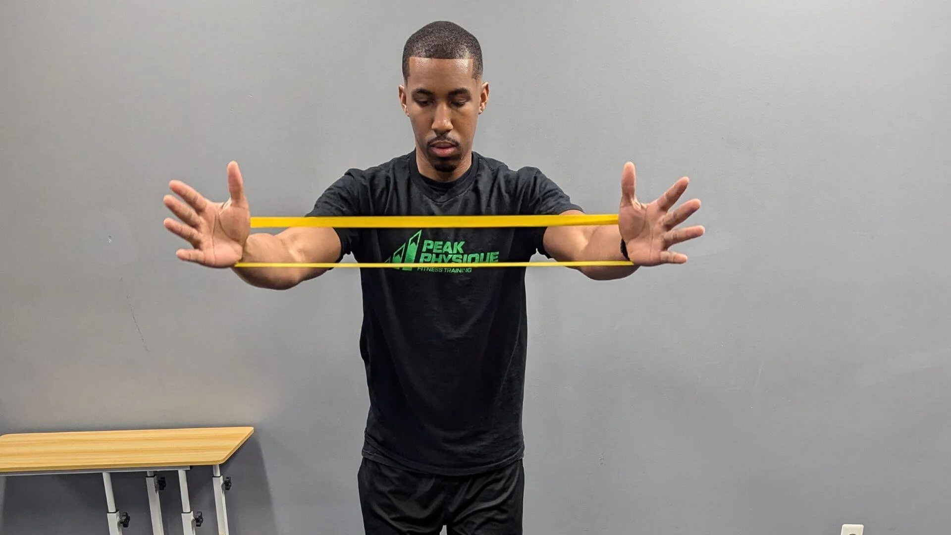 personal trainer in troy mi showing band exercises