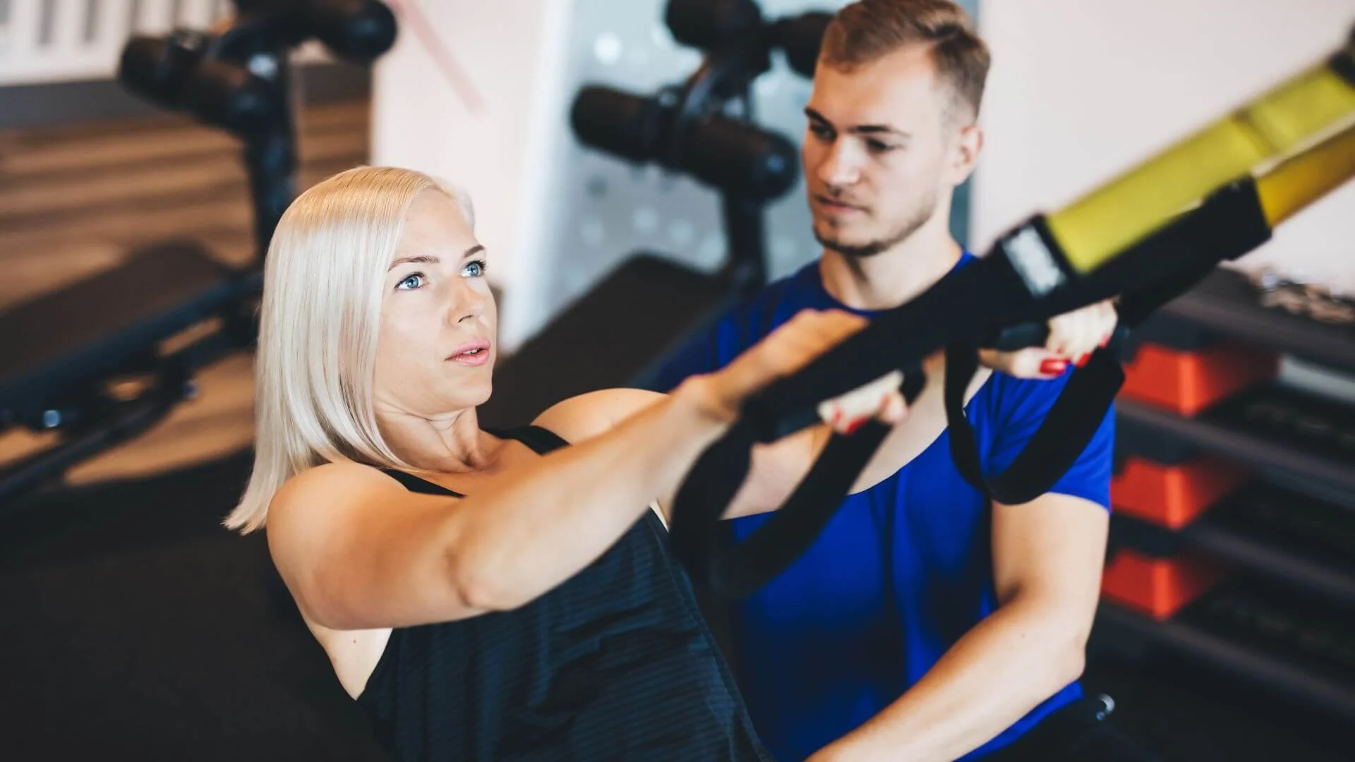 woman exercising with her personal trainer