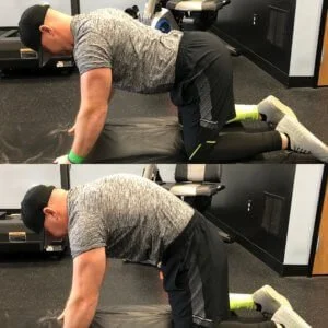 personal trainer showing how to do a Cat-Cow