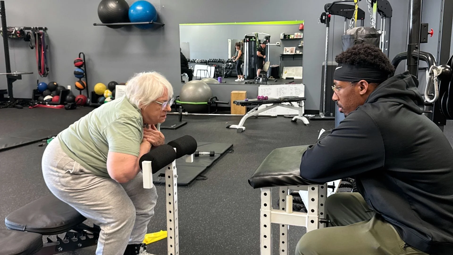 client exercising with a personal trainer in our troy michigan gym