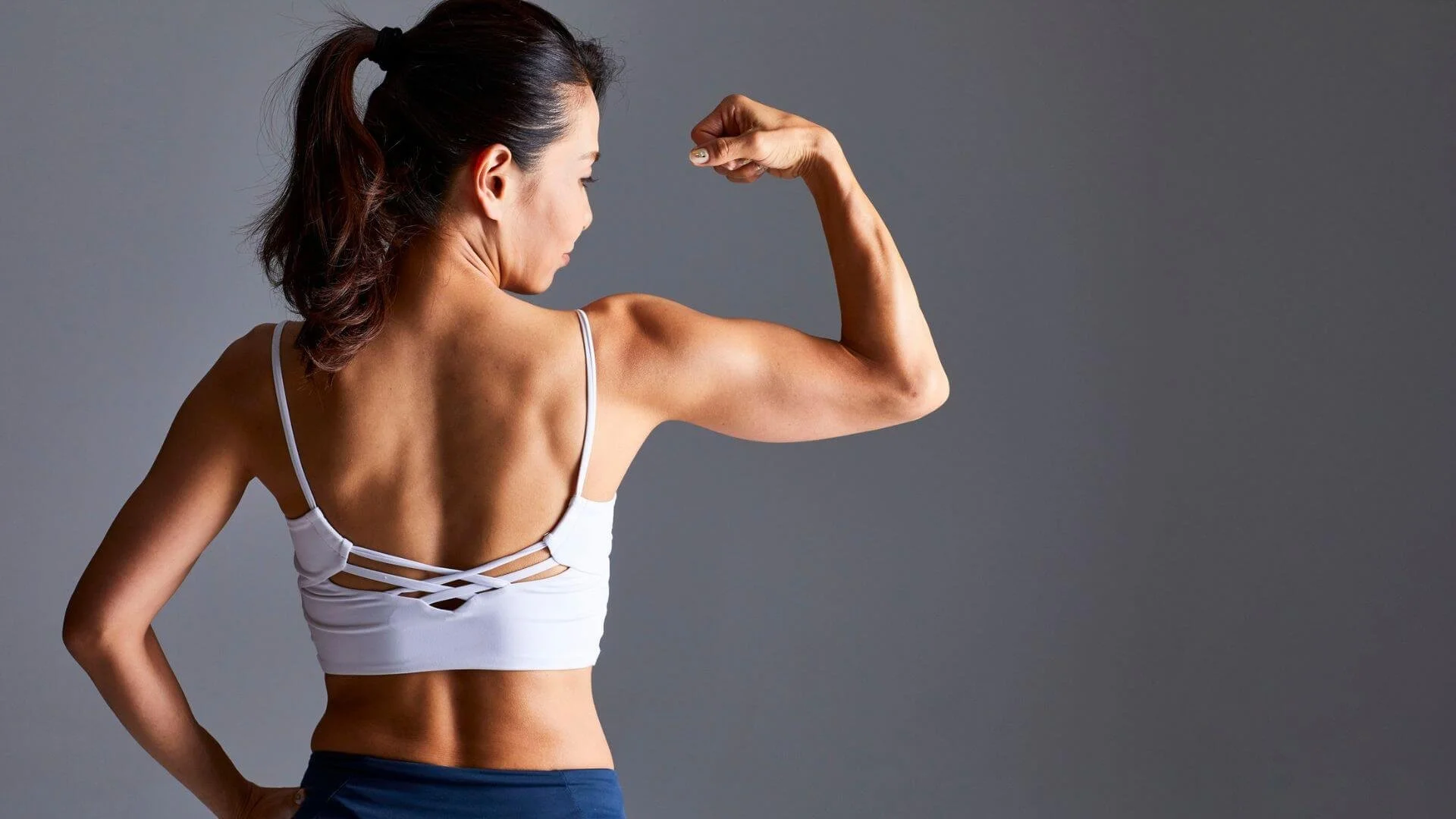 woman flexing her muscles