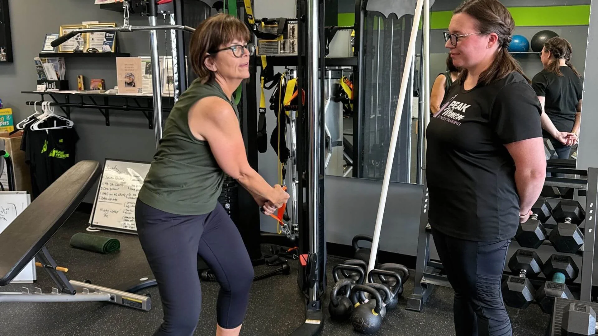 personal trainer watching a client exercise at our personal training studio in troy, michigan