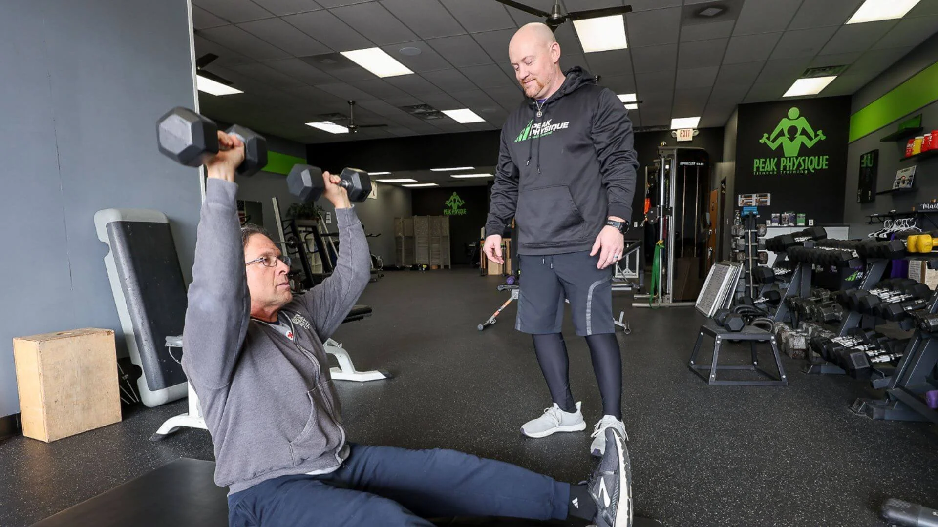 Nick, personal trainer at Peak Physique in Troy, MI watching a client exercise