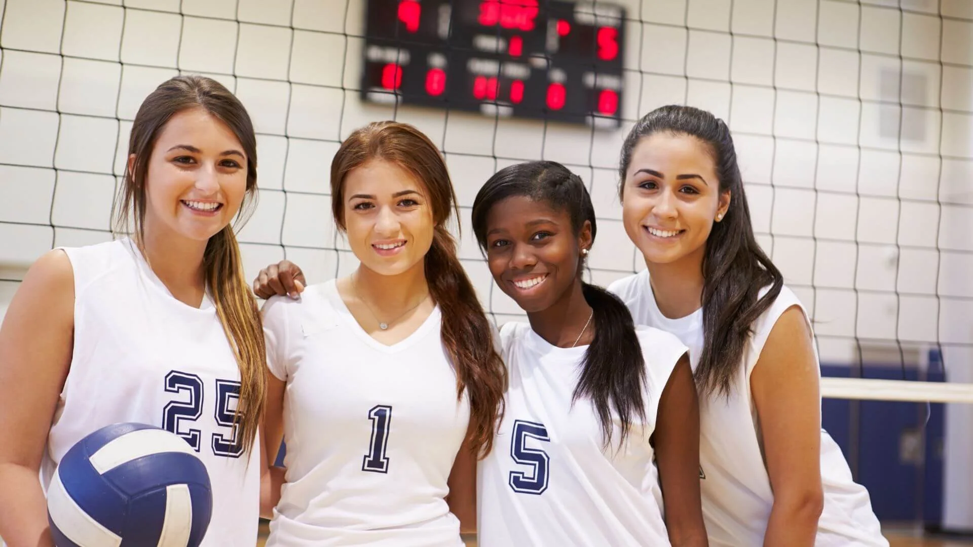 women standing together wearing vollyball uniwform