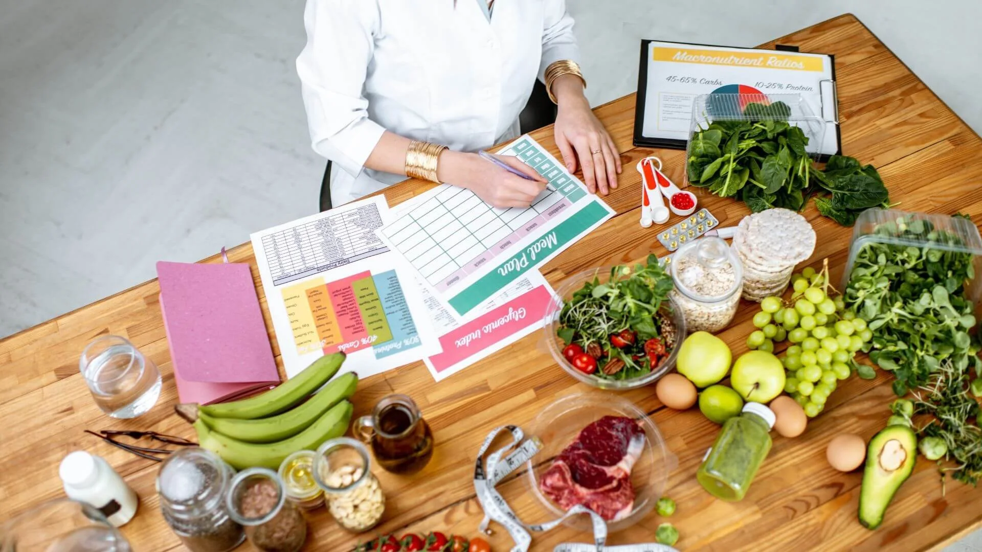 a table filled with meal prepping ingredients and menu plan