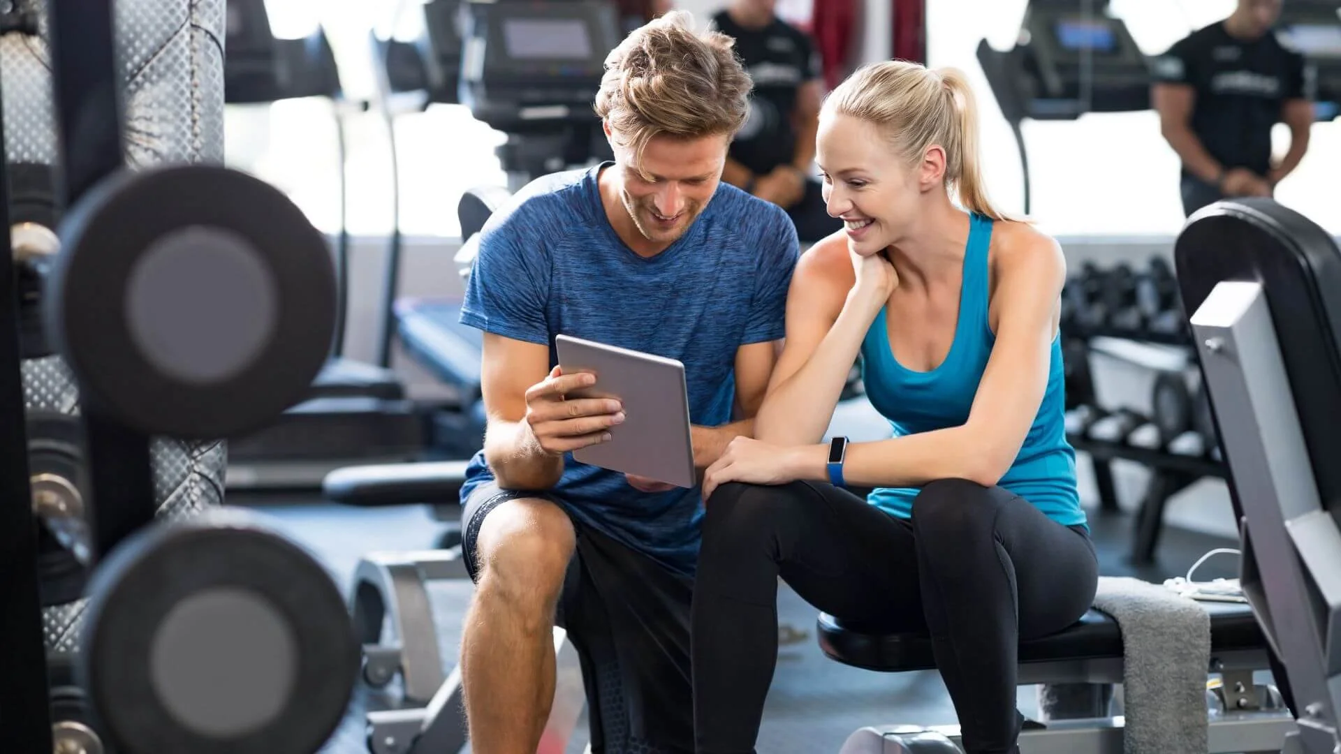 personal trainer talking to a client