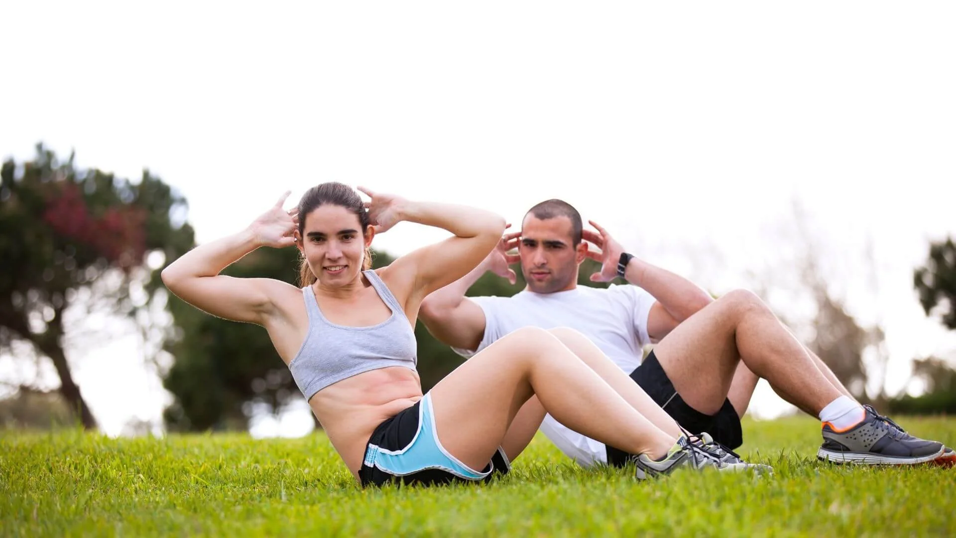 two people happily exercising outside