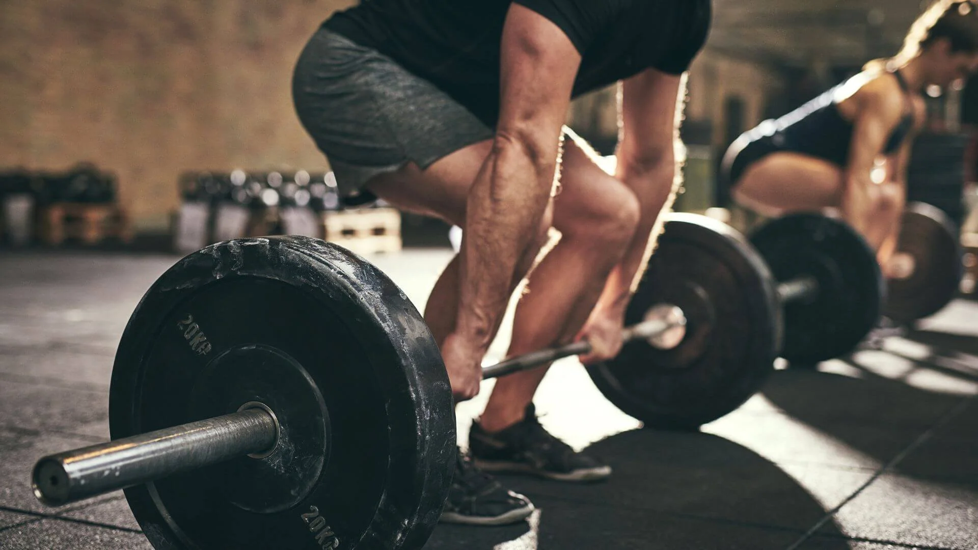 man lifting weights for strength training