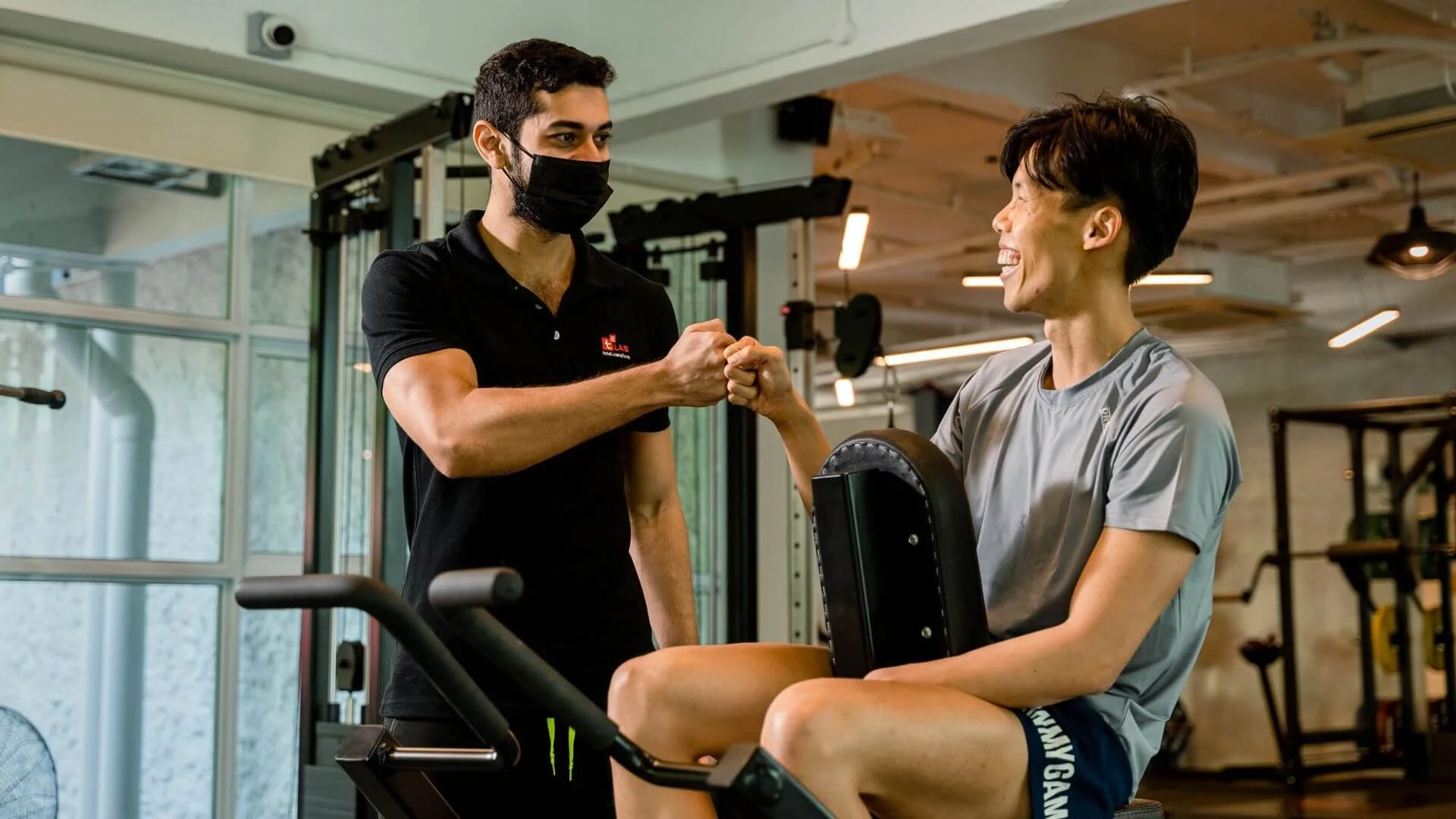 male personal trainer working with a male client