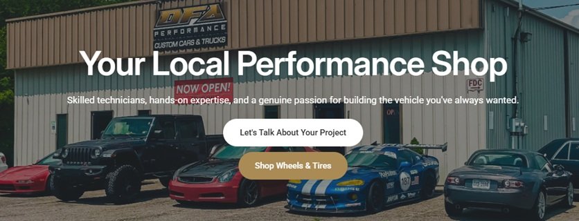 Exterior of a performance car shop with sports cars and trucks parked outside, signage showing 'Your Local Performance Shop' and 'NOW OPEN!'