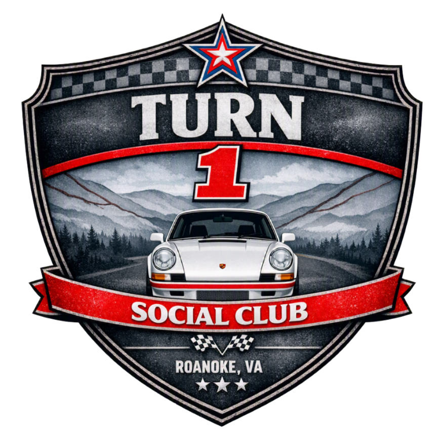 A badge with a racing car and mountain background, featuring the text 'Turn 1 Social Club Roanoke, VA'.