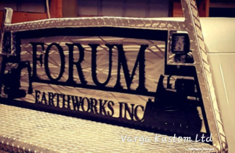 Metal sign with the text 'FORUM EARTHWORKS INC' reflecting on a surface.