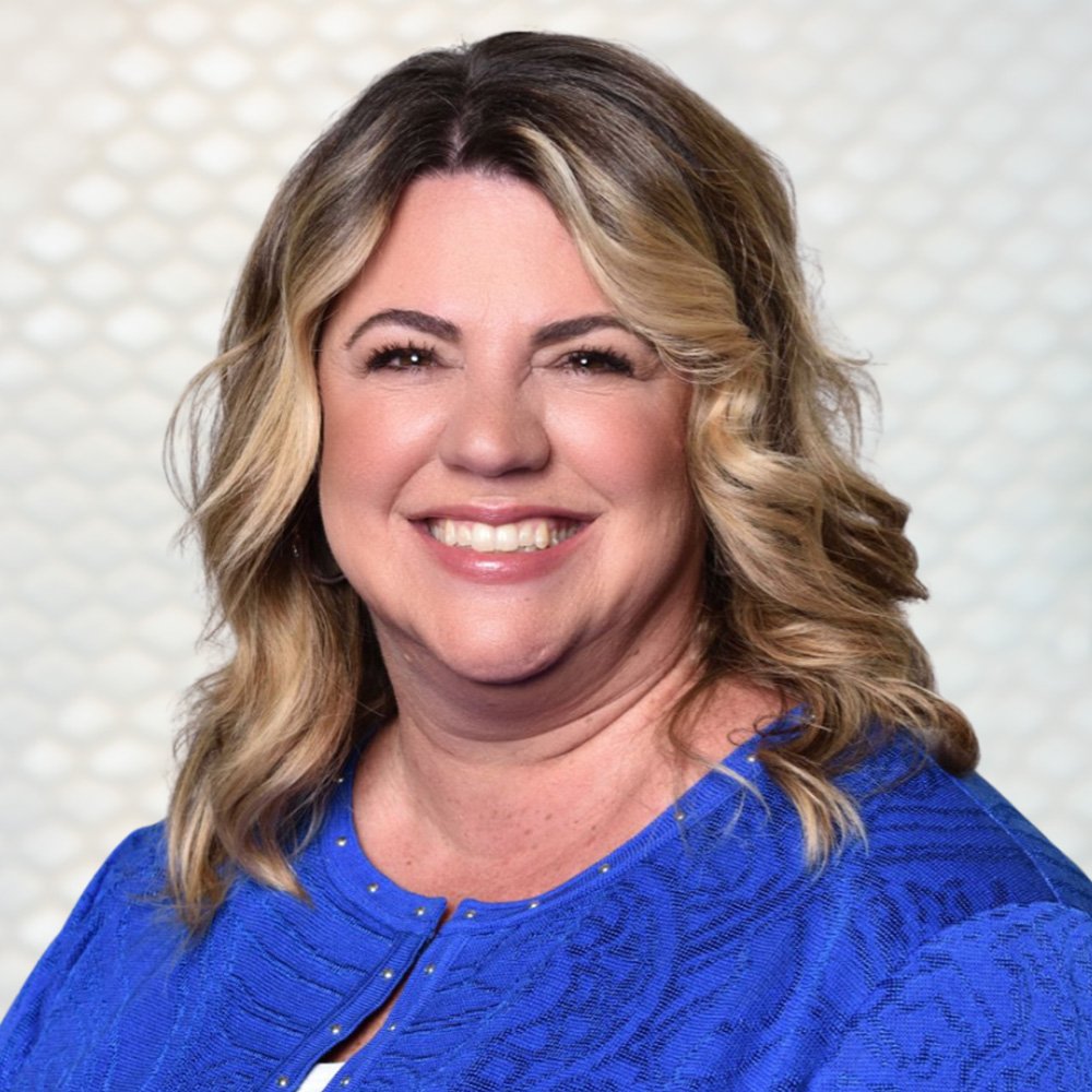 Headshot of Kara Hertzog, President of IES, featured in REVERED: The Power of Female Leadership