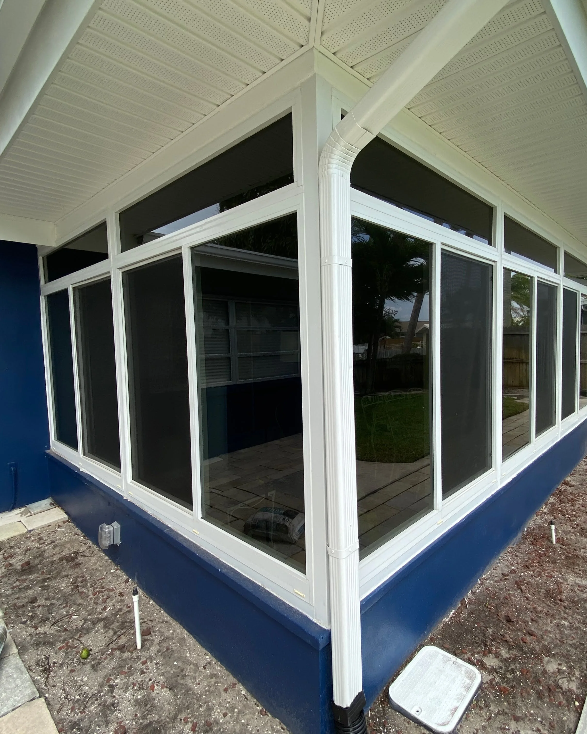 Replaced energy-efficient windows on Clearwater property with clean white framing
