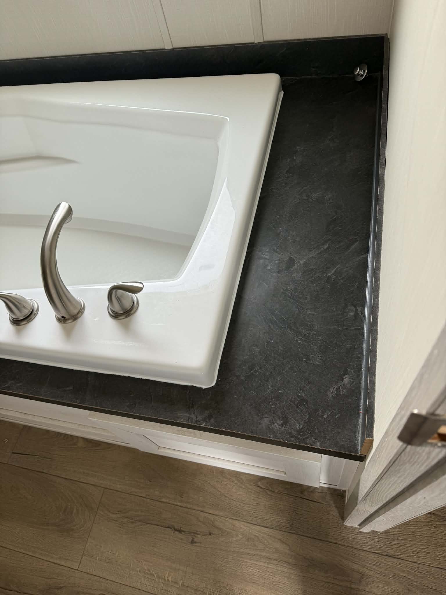 Fresh bathtub recaulking for a clean look and long-lasting protection against water damage.
