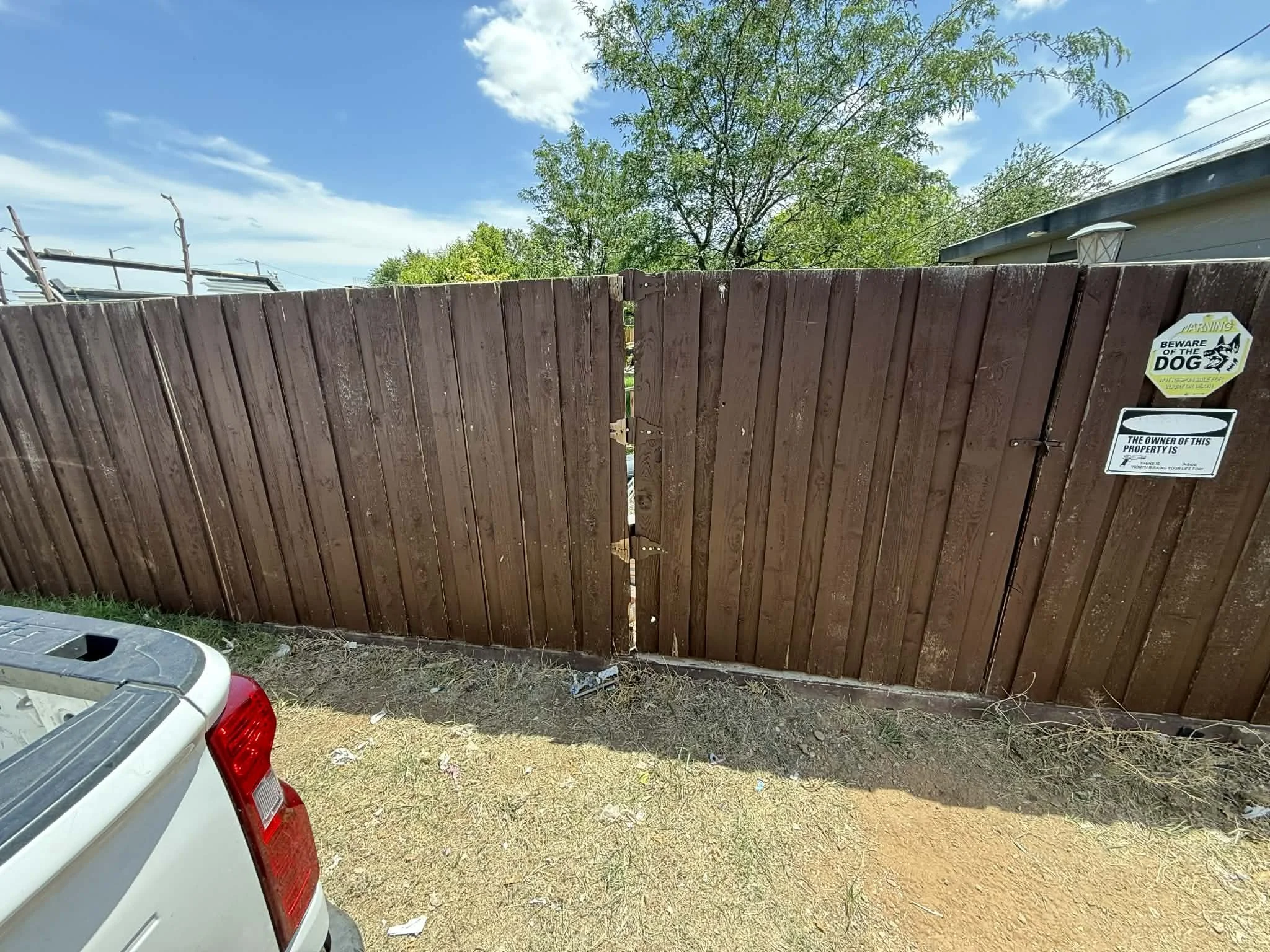 Repaired and reinforced the fence for improved durability and a clean, finished look.