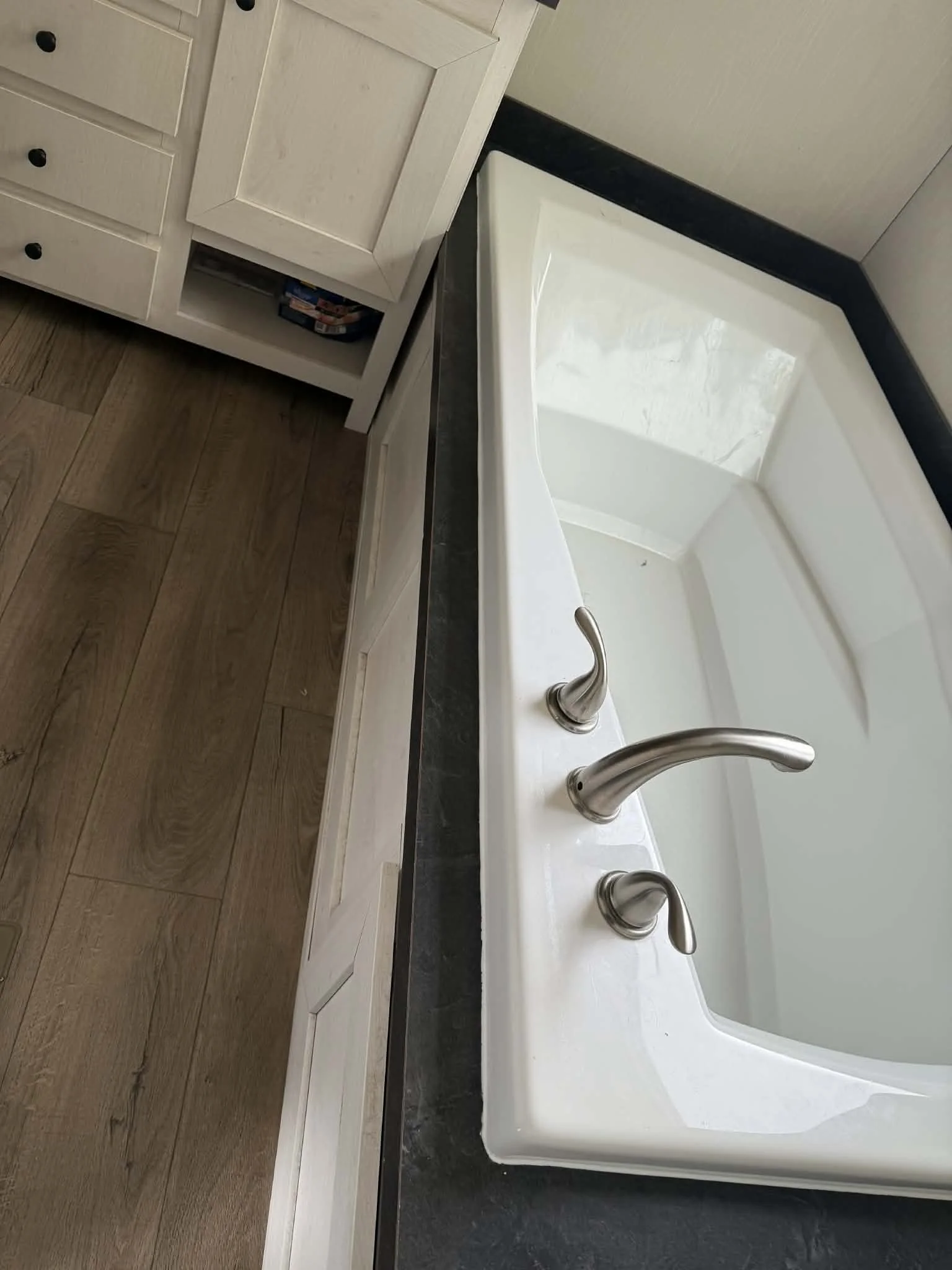 Fresh bathtub recaulking for a clean look and long-lasting protection against water damage.