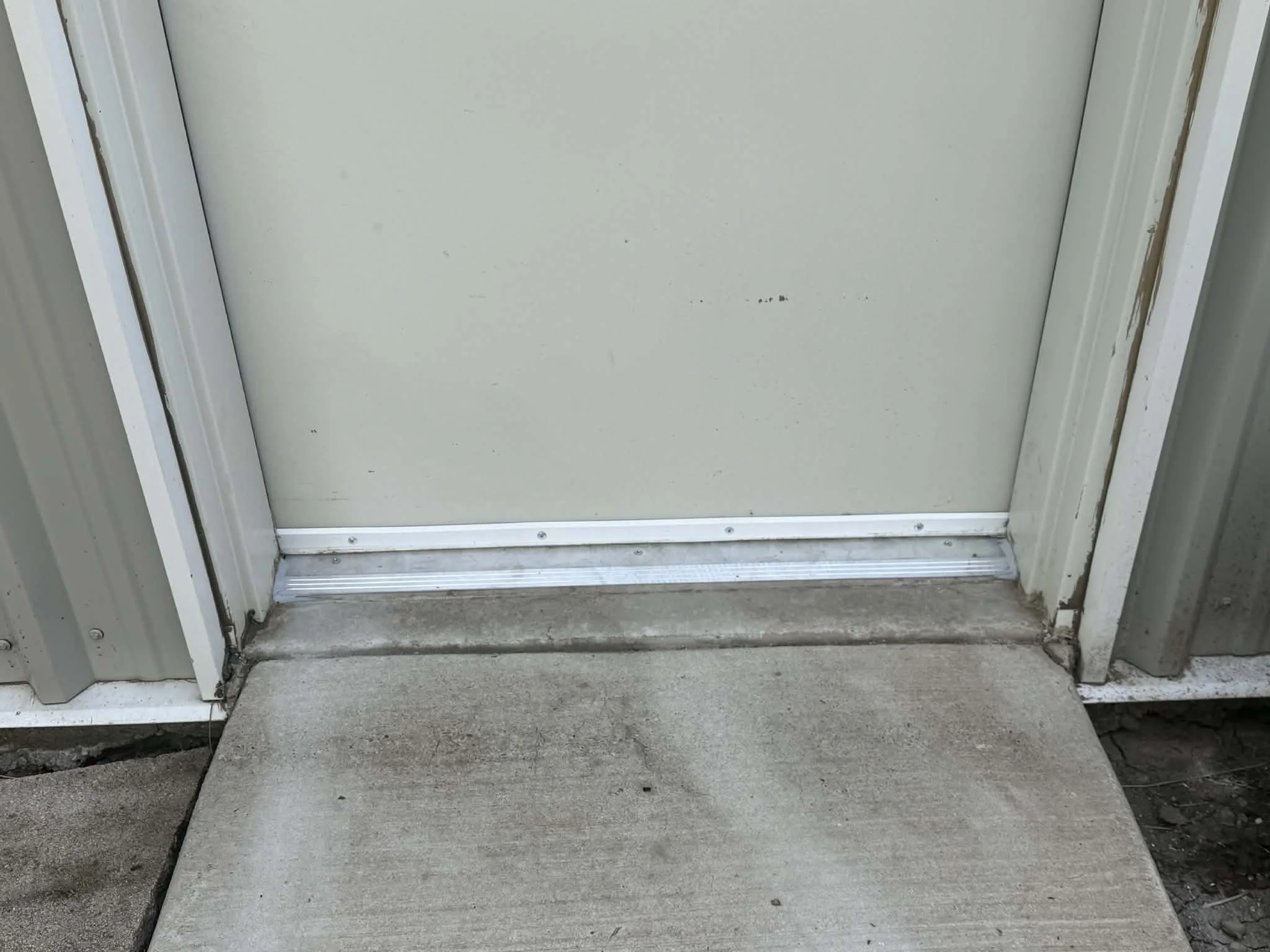 Replaced a worn door threshold to improve the seal, functionality, and appearance of the doorway. 