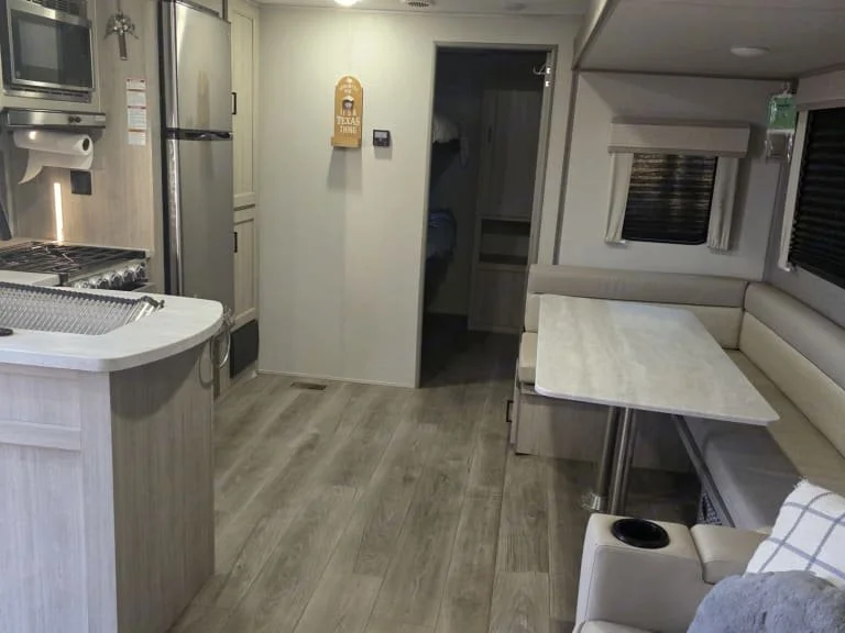 Sleeps up to 8 – Queen master bedroom, private bunkhouse with queen bunks & convertible dinette & jackknife sofa. One slide out on the driver side. Full Kitchen – Refrigerator, stove, oven, microwave, sink, and all the basic cookware & utensils. Ente